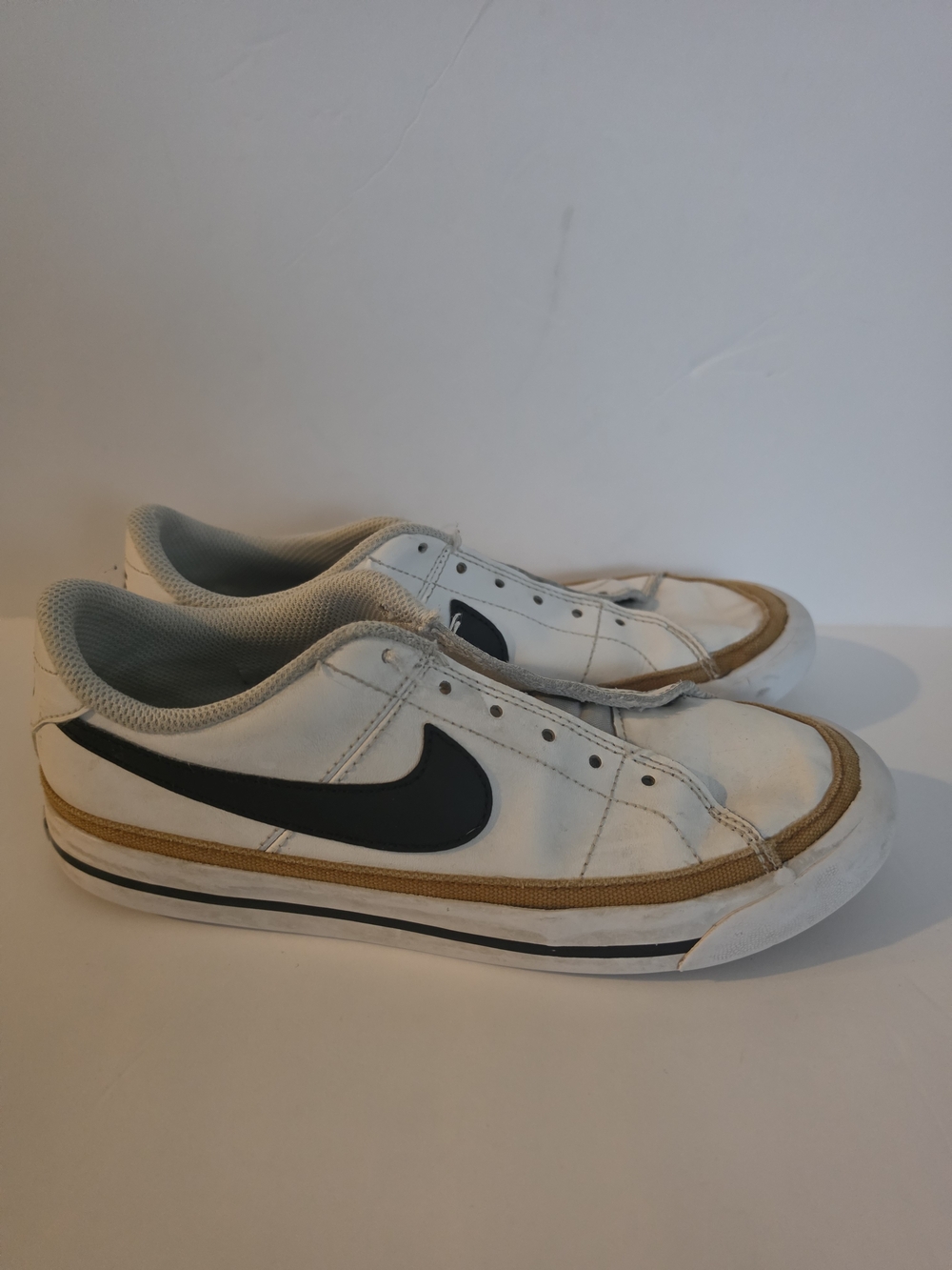 Nike Men’s White Canvas Low-Top Sneakers with Black Swoosh